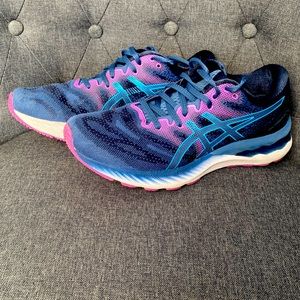 ASICS Navy blue, pinkish purple and a shiny blue ASICS sign on the side.